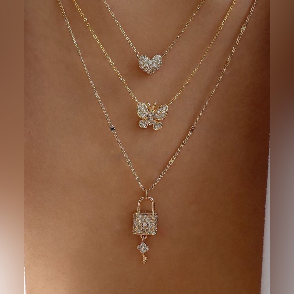 Gold Layered Necklace Set with Heart, Butterfly, and Lock Pendants - Picture 3 of 6